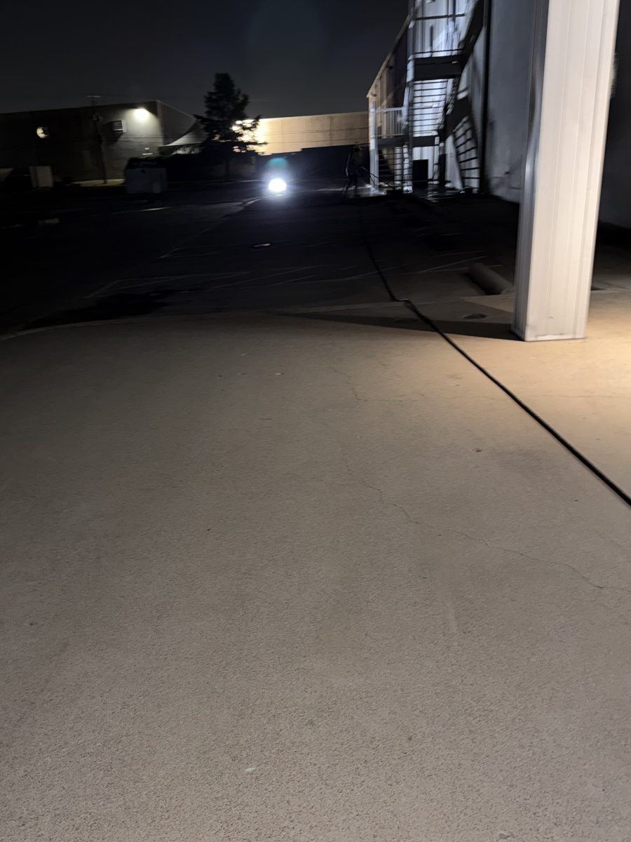 Bright restored commercial concrete parking area after pressure washing in the DFW area