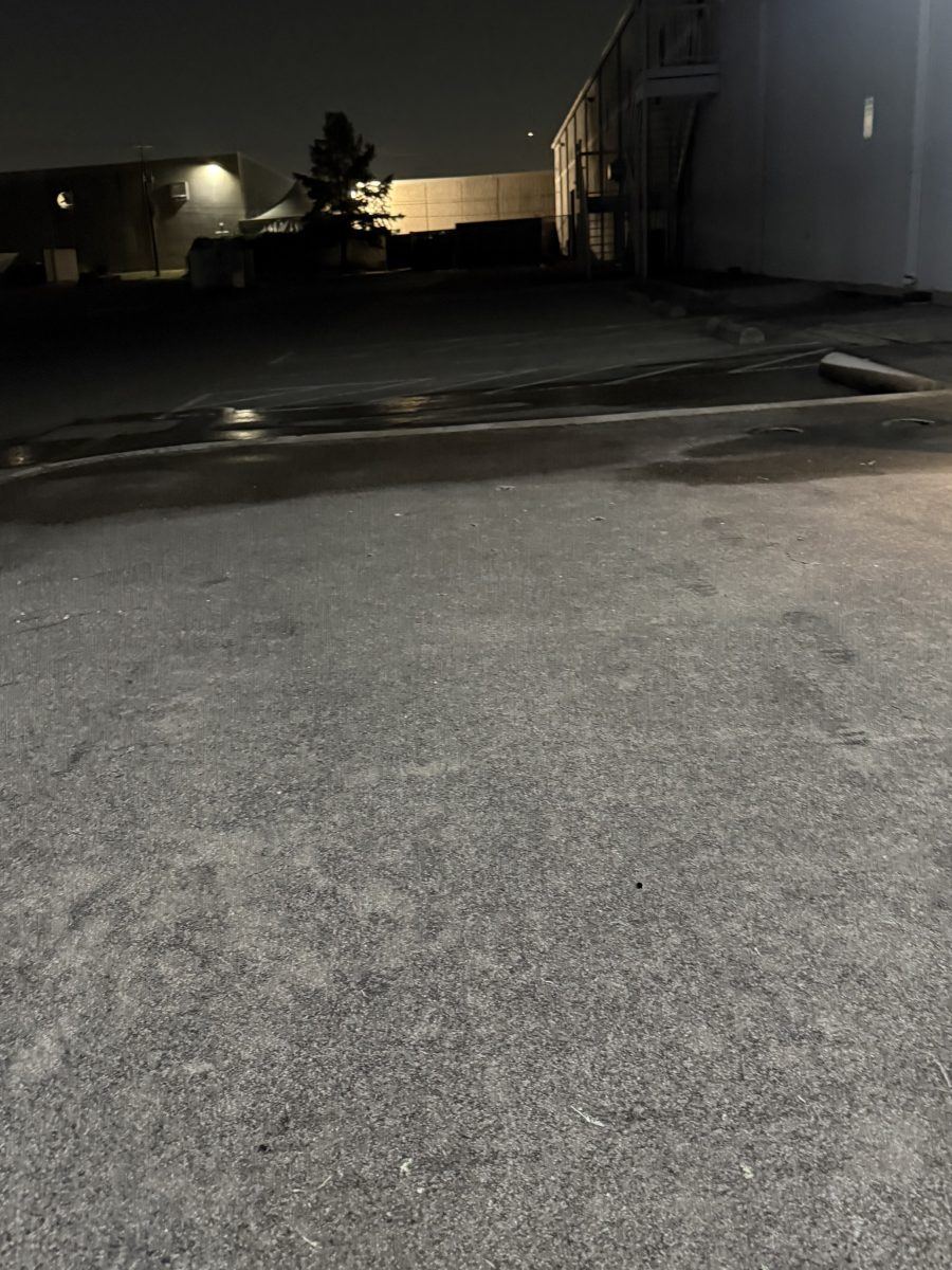 Dirty commercial concrete parking area before pressure washing in the DFW area