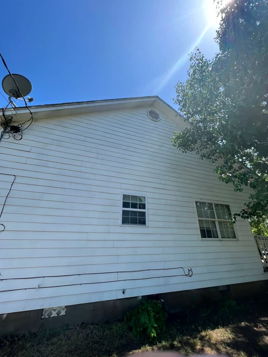 Clean bright white house siding after pressure washing — Arlington, TX