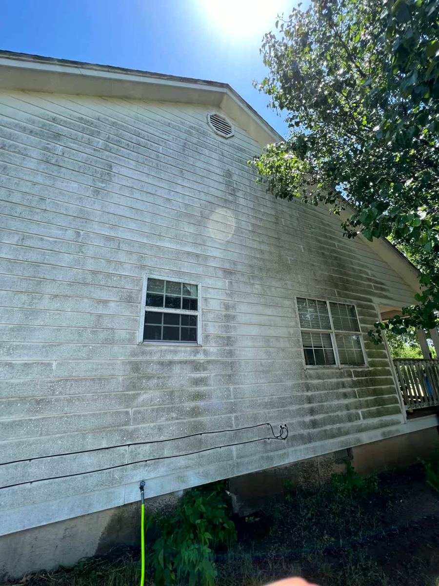 House siding covered in heavy mold and dirt before pressure washing — Arlington, TX